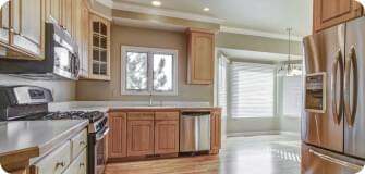 a kitchen with a stove, microwave and refridgerator